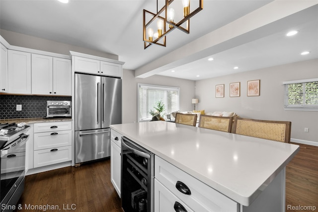 389 Kercheval Ave, Grosse Pointe, MI 48236 - kitchen featuring high end refrigerator, beverage cooler, gas range oven, dark wood-type flooring, and recessed lighting