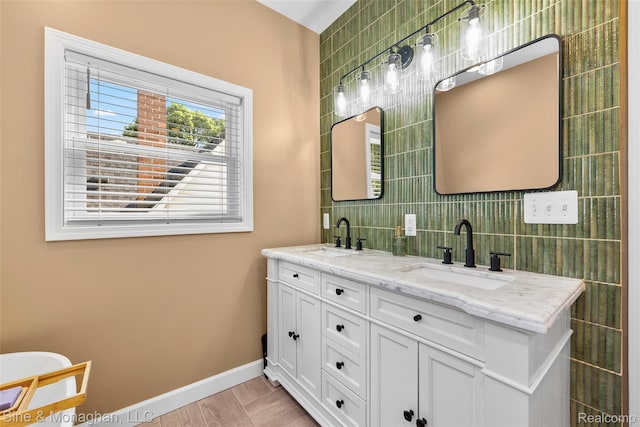 389 Kercheval Ave, Grosse Pointe, MI 48236 - full bathroom featuring tile walls, double vanity, and tasteful backsplash