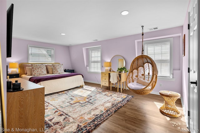 389 Kercheval Ave, Grosse Pointe, MI 48236 - bedroom featuring multiple windows, wood finished floors, and recessed lighting