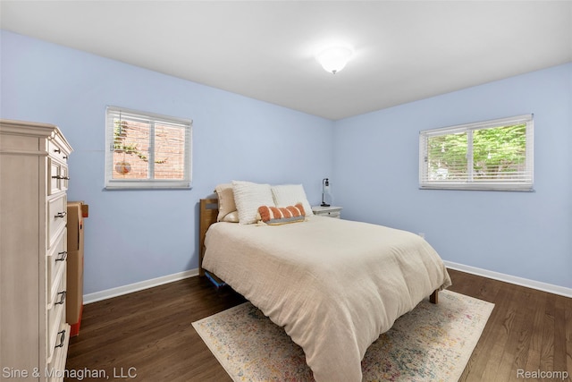 389 Kercheval Ave, Grosse Pointe, MI 48236 - bedroom with baseboards and dark wood-style floors