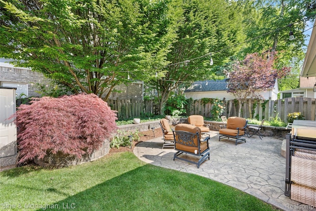 389 Kercheval Ave, Grosse Pointe, MI 48236 - fenced backyard featuring a patio and an outdoor living space