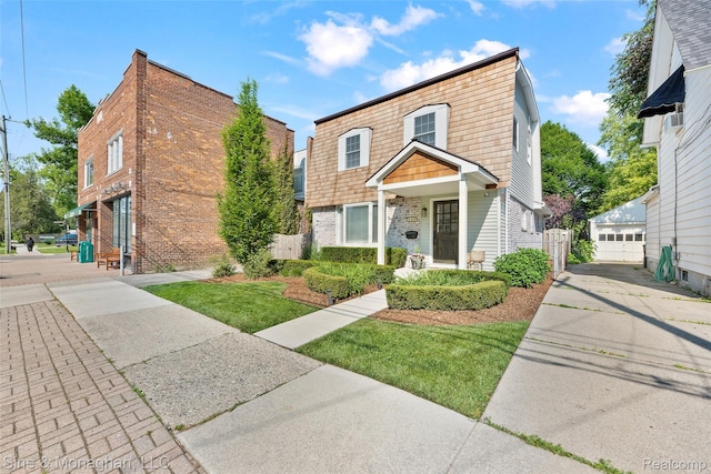 389 Kercheval Ave, Grosse Pointe, MI 48236 - view of front facade with brick siding and a garage