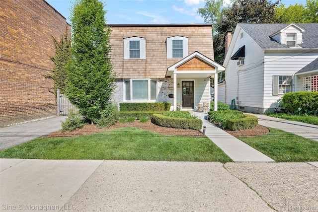 389 Kercheval Ave, Grosse Pointe, MI 48236 - view of front facade featuring a front lawn