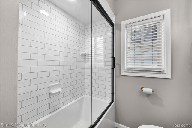 389 Kercheval Ave, Grosse Pointe, MI 48236 - bathroom featuring baseboards and bath / shower combo with glass door