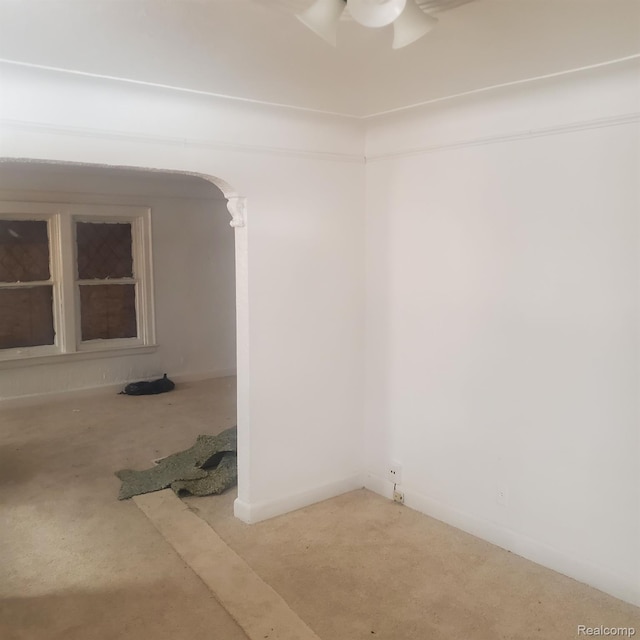 8229 Carlin St, Detroit, MI 48228 - carpeted spare room with arched walkways and a ceiling fan