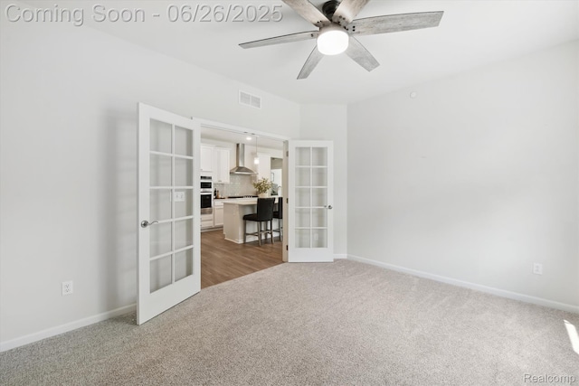 1065 Spring Trail Ct, Brighton, MI 48116 - carpeted spare room featuring french doors and ceiling fan