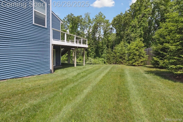1065 Spring Trail Ct, Brighton, MI 48116 - view of green lawn with a wooden deck