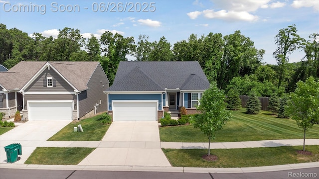 1065 Spring Trail Ct, Brighton, MI 48116 - view of front of home with a front lawn, driveway, and an attached garage