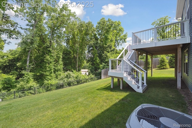 1065 Spring Trail Ct, Brighton, MI 48116 - fenced backyard with stairs and a wooden deck
