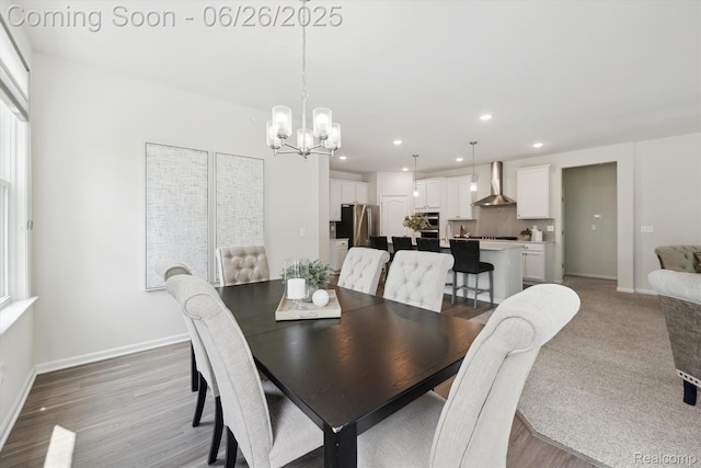 1065 Spring Trail Ct, Brighton, MI 48116 - dining space featuring a chandelier, light wood finished floors, recessed lighting, and healthy amount of natural light