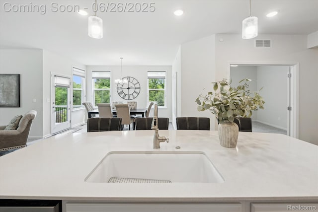 1065 Spring Trail Ct, Brighton, MI 48116 - kitchen with open floor plan, a chandelier, hanging light fixtures, recessed lighting, and light countertops