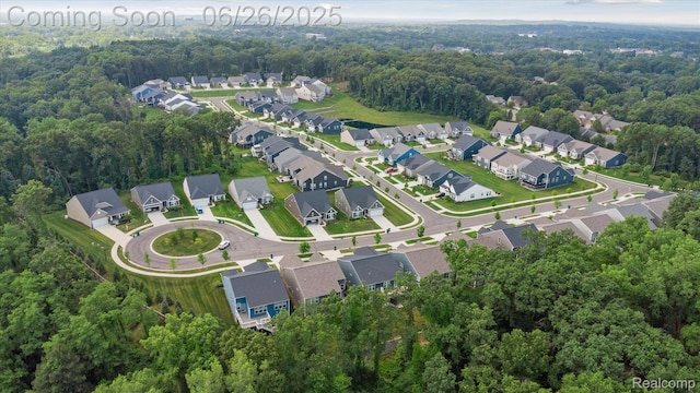 1065 Spring Trail Ct, Brighton, MI 48116 - aerial view of property and surrounding area with nearby suburban area and a forest