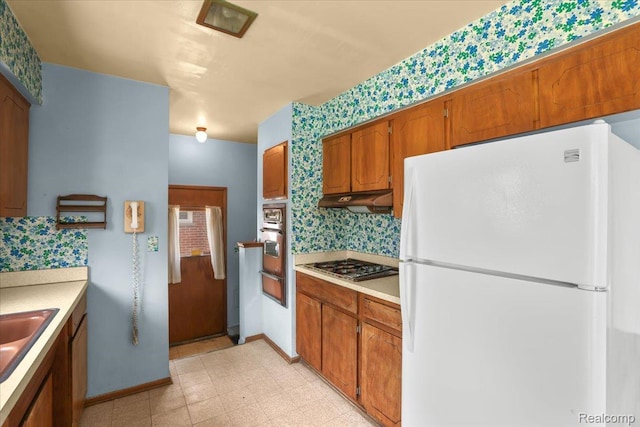 4663 Marian Ave, Warren, MI 48092 - kitchen featuring white appliances, light floors, light countertops, and under cabinet range hood