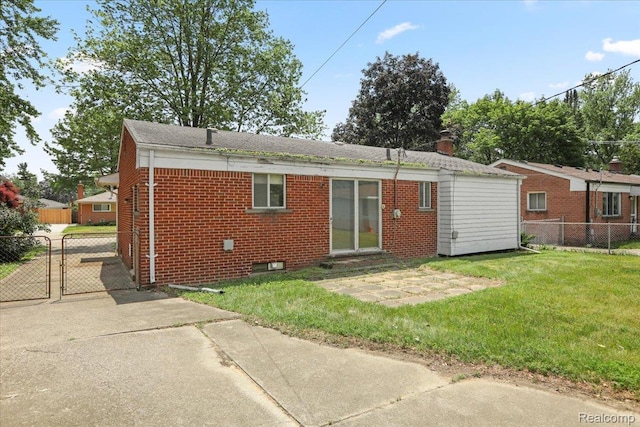 4663 Marian Ave, Warren, MI 48092 - rear view of property featuring brick siding and a gate