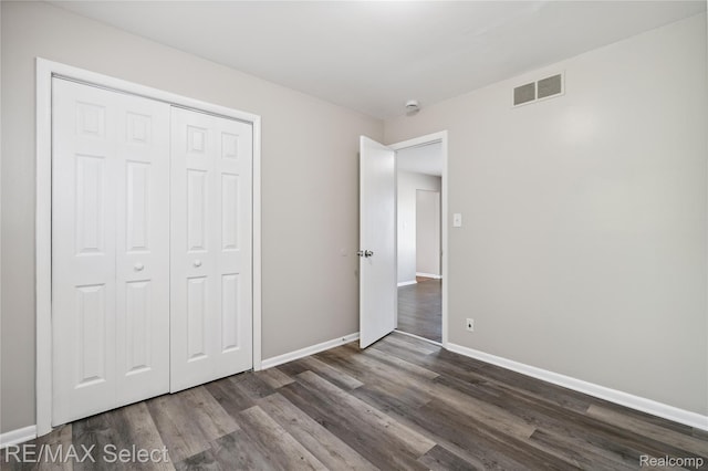 3062 Walton Ave, Davison, MI 48504 - unfurnished bedroom featuring dark wood finished floors and a closet