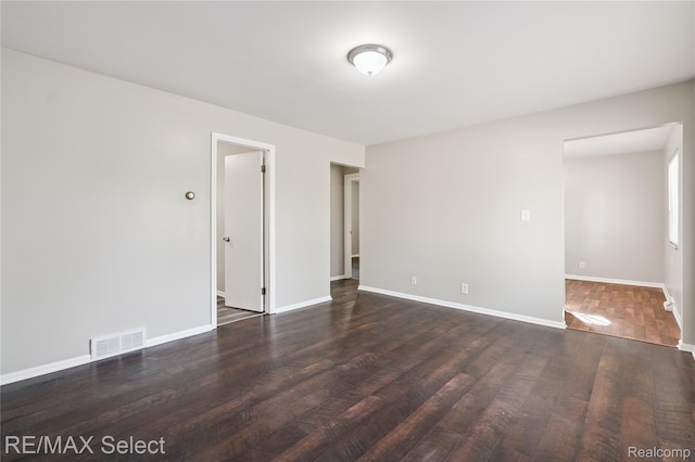3062 Walton Ave, Davison, MI 48504 - spare room with dark wood-style floors and baseboards