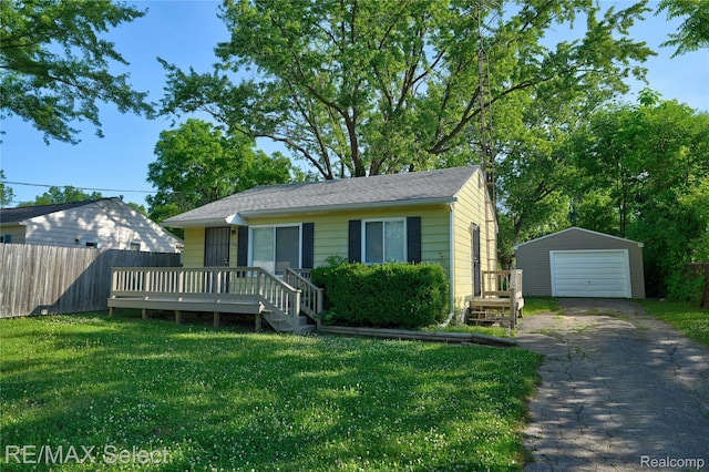 3062 Walton Ave, Davison, MI 48504 - bungalow with driveway, a garage, an outdoor structure, and a deck