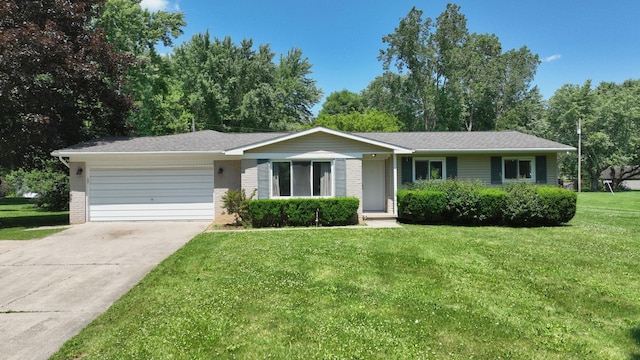 7106 Partridge Dr, Flushing, MI 48433 - single story home featuring an attached garage, a front yard, concrete driveway, and brick siding