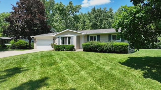 7106 Partridge Dr, Flushing, MI 48433 - single story home with driveway, an attached garage, and a front lawn
