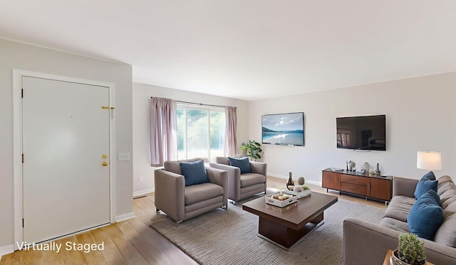 7106 Partridge Dr, Flushing, MI 48433 - living room with light wood-style floors and baseboards