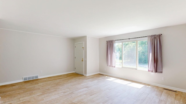 7106 Partridge Dr, Flushing, MI 48433 - spare room featuring light wood-style flooring and baseboards