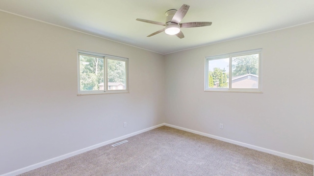 7106 Partridge Dr, Flushing, MI 48433 - carpeted spare room featuring healthy amount of natural light and a ceiling fan