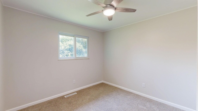 7106 Partridge Dr, Flushing, MI 48433 - carpeted empty room featuring baseboards and a ceiling fan