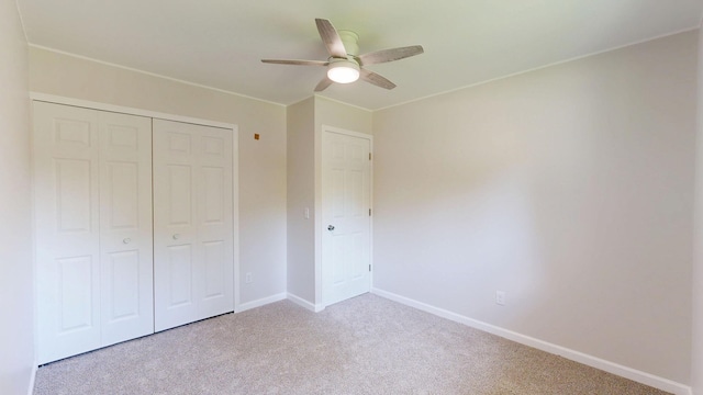 7106 Partridge Dr, Flushing, MI 48433 - unfurnished bedroom featuring carpet flooring, a closet, and a ceiling fan