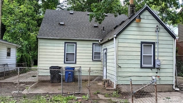 15989 Dalby, Redford, MI 48239 - back of house featuring roof with shingles and a chimney