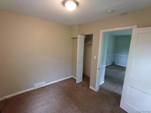 15989 Dalby, Redford, MI 48239 - unfurnished bedroom with dark colored carpet and a closet