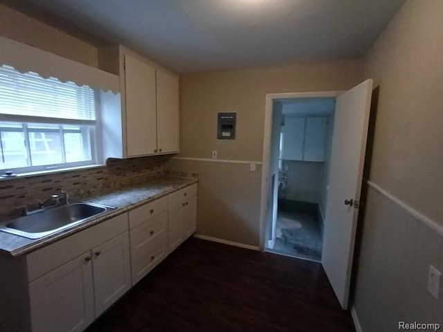 15989 Dalby, Redford, MI 48239 - kitchen featuring white cabinetry, dark wood-style floors, and backsplash