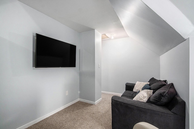 814 12th St NW, Grand Rapids, MI 49504 - carpeted living area featuring lofted ceiling and baseboards