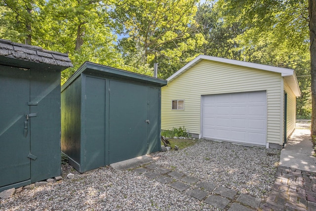 12963 E Englewright Dr, Sand Lake, MI 49343 - detached garage with a storage unit