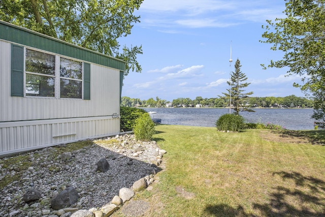 12963 E Englewright Dr, Sand Lake, MI 49343 - view of grassy yard featuring a water view
