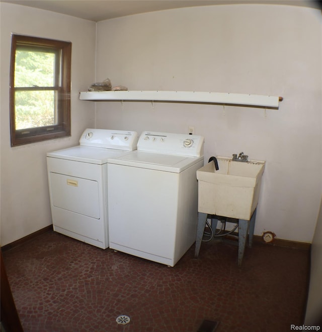 320 Nancy Bird Ln, Clarkston, MI 48371 - laundry room with washer and clothes dryer and baseboards