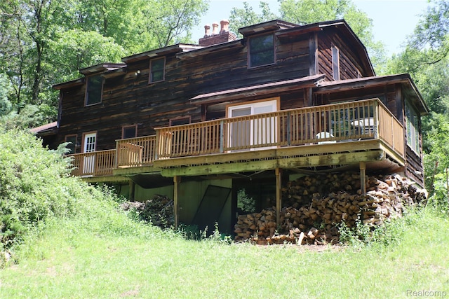 320 Nancy Bird Ln, Clarkston, MI 48371 - rear view of property featuring a chimney and a deck