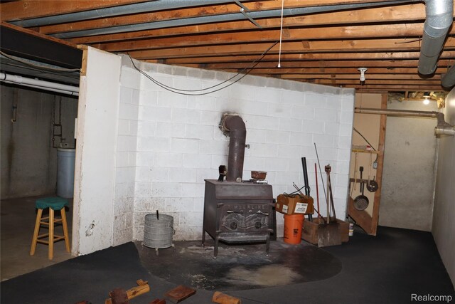 320 Nancy Bird Ln, Clarkston, MI 48371 - basement featuring a wood stove