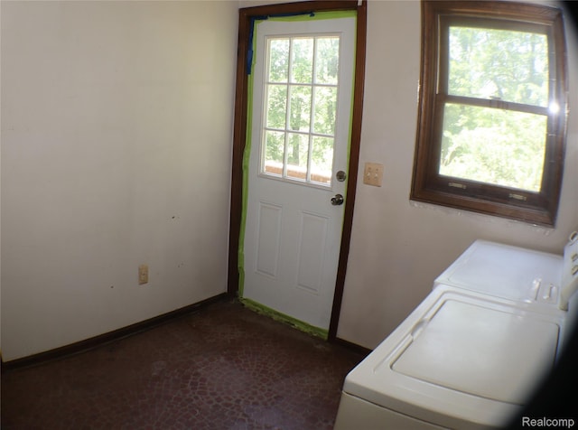 320 Nancy Bird Ln, Clarkston, MI 48371 - laundry room featuring independent washer and dryer and baseboards