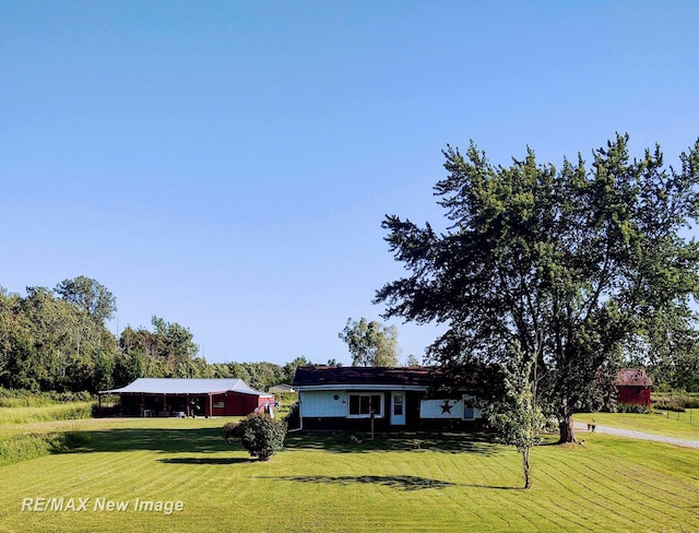 4230 E M-55, Prescott, MI 48756 - single story home with a front lawn and dirt driveway