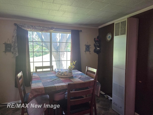 4230 E M-55, Prescott, MI 48756 - dining space featuring a heating unit and crown molding