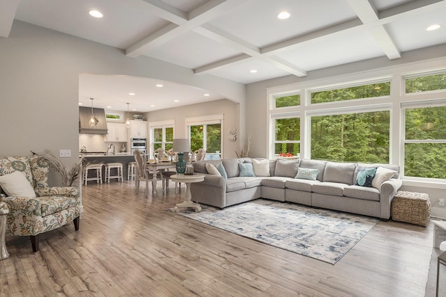 3479 Jeffrey Spur, Hamilton, MI 49419 - living area with light wood-style flooring, beam ceiling, recessed lighting, coffered ceiling, and arched walkways