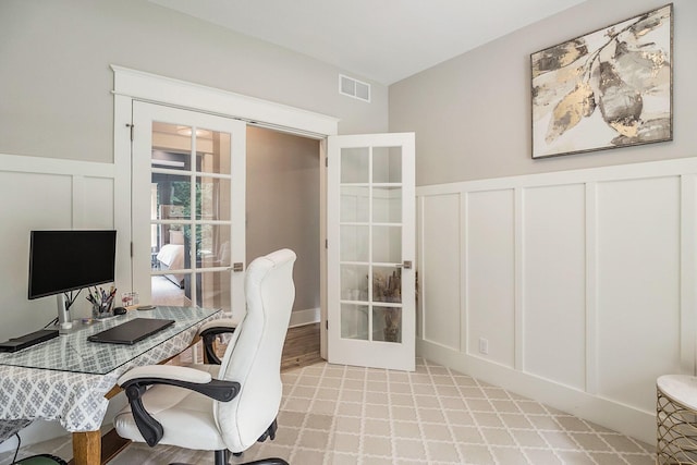 3479 Jeffrey Spur, Hamilton, MI 49419 - home office featuring a decorative wall, french doors, and a wainscoted wall