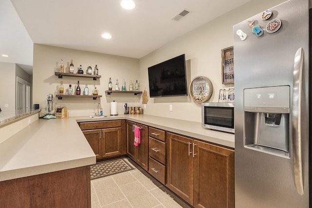 3479 Jeffrey Spur, Hamilton, MI 49419 - kitchen featuring stainless steel appliances, open shelves, light countertops, recessed lighting, and light tile patterned flooring