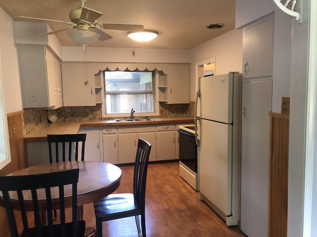 1113 Nichols Rd, Kalamazoo, MI 49006 - kitchen featuring white appliances, a ceiling fan, tasteful backsplash, white cabinetry, and wood finished floors