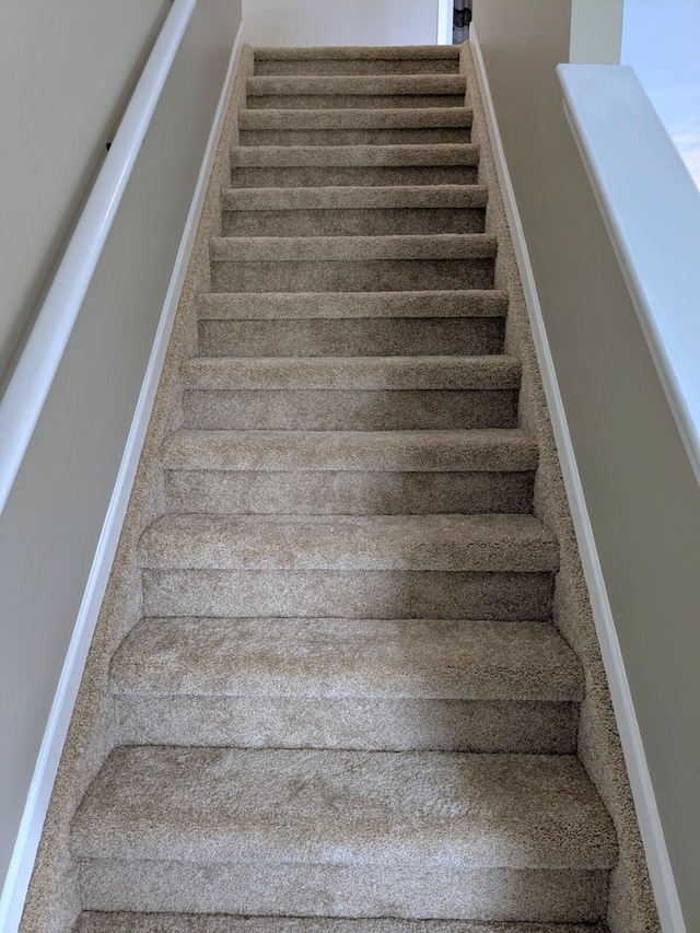 6766 Poplar Dr, Ypsilanti, MI 48197 - stairway featuring baseboards and carpet flooring