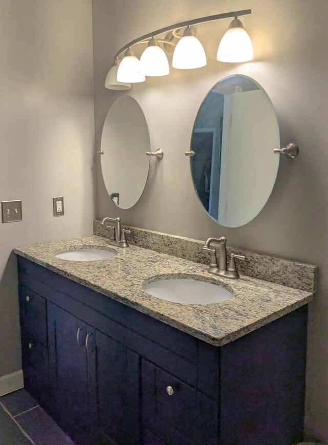 6766 Poplar Dr, Ypsilanti, MI 48197 - bathroom with double vanity and tile patterned flooring