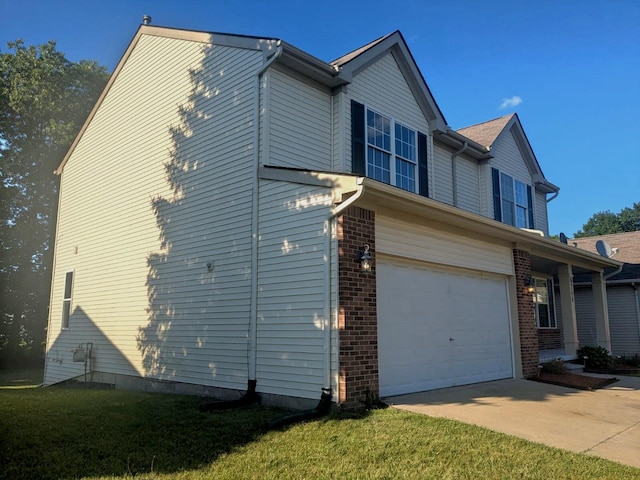 6766 Poplar Dr, Ypsilanti, MI 48197 - view of side of property featuring brick siding, a garage, driveway, and a yard