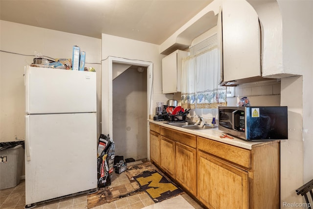 11358 Asbury Park, Detroit, MI 48205 - kitchen featuring freestanding refrigerator, stainless steel microwave, and light countertops