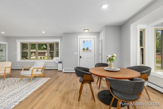 630 Westview Ave NW, Grand Rapids, MI 49504 - dining space featuring recessed lighting, a baseboard heating unit, light wood-style floors, and baseboard heating