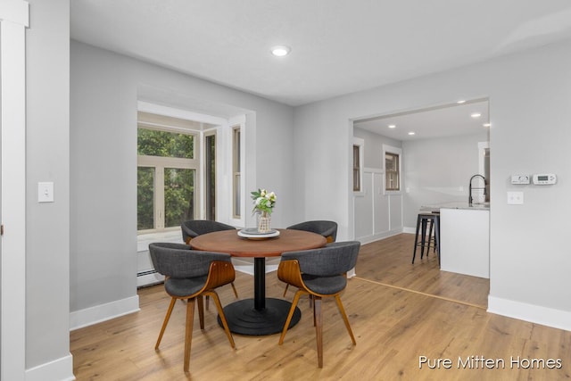 630 Westview Ave NW, Grand Rapids, MI 49504 - dining space featuring recessed lighting, light wood-style floors, and baseboard heating